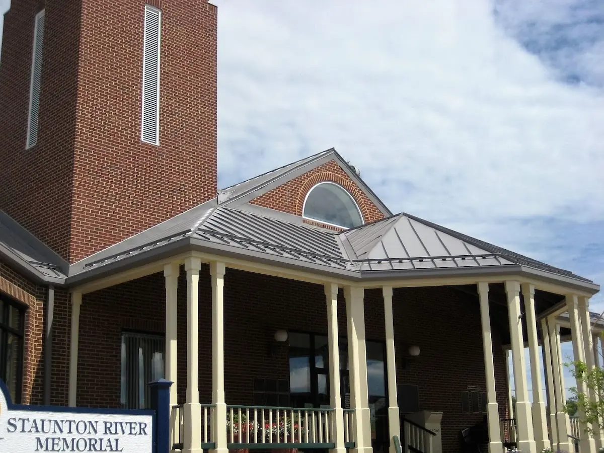 Skilled roofing craftsmen working on a residential roof in Spring City